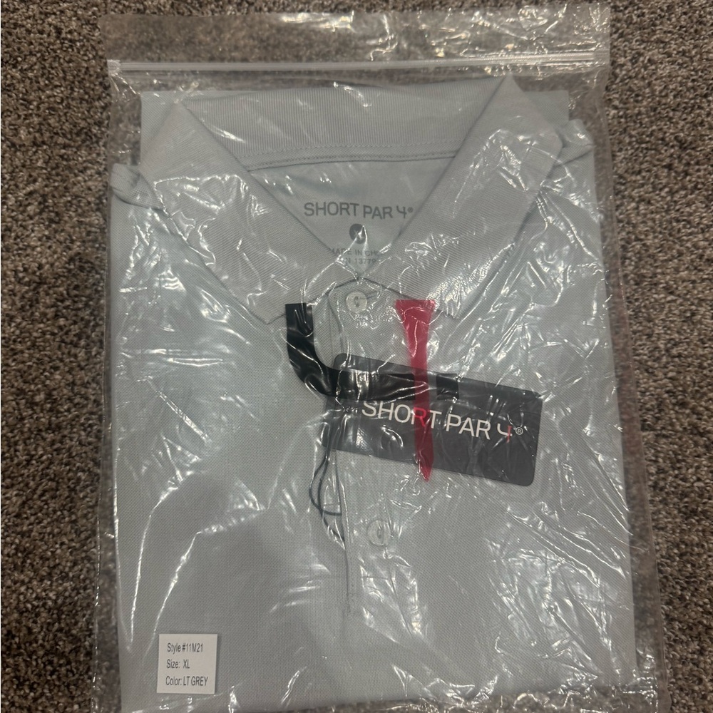Gray Polo Shirt with Black Tag and Pink Accent